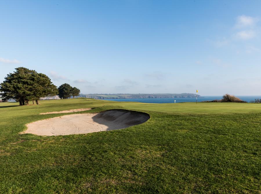 view of 8th Green bunker with sea at carlyon bay