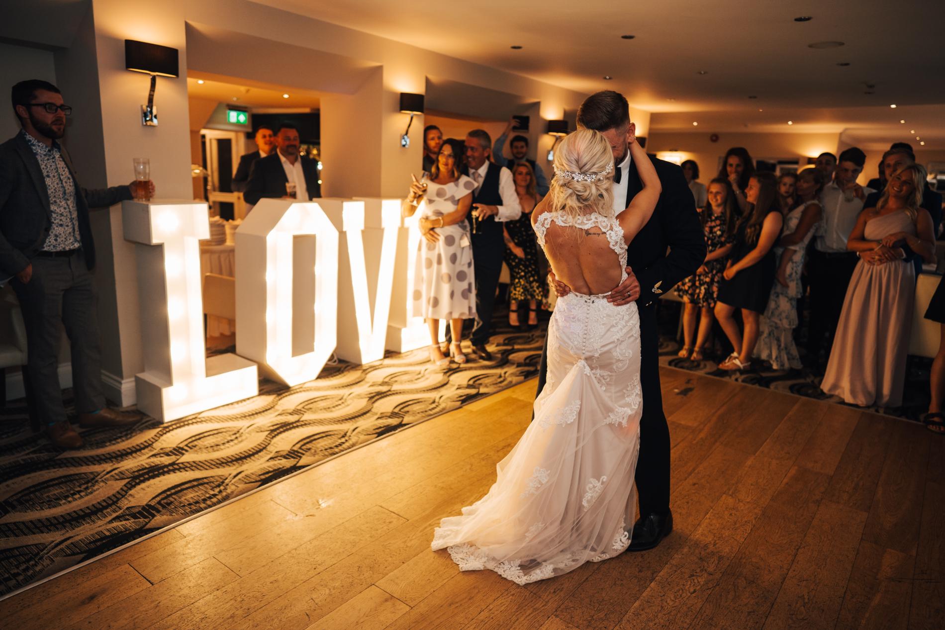 Couple having their first dance at the Carlyon Clubhouse, photography by Joshua Penrose