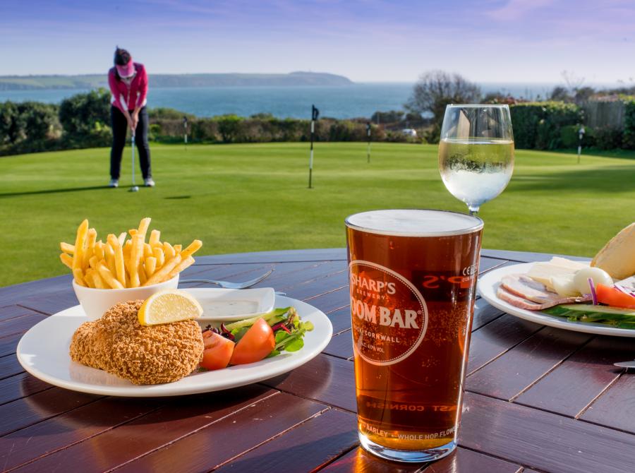 lunch and pint on table on terrace at Carlyon Golf Clubhouse