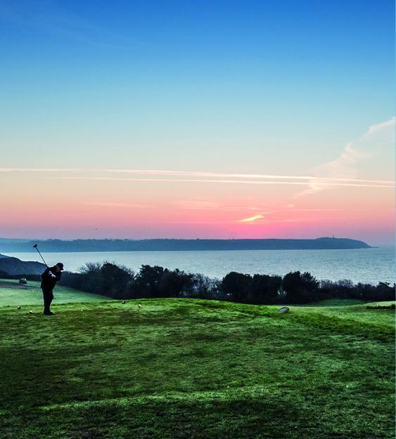 Golfer and sunrise