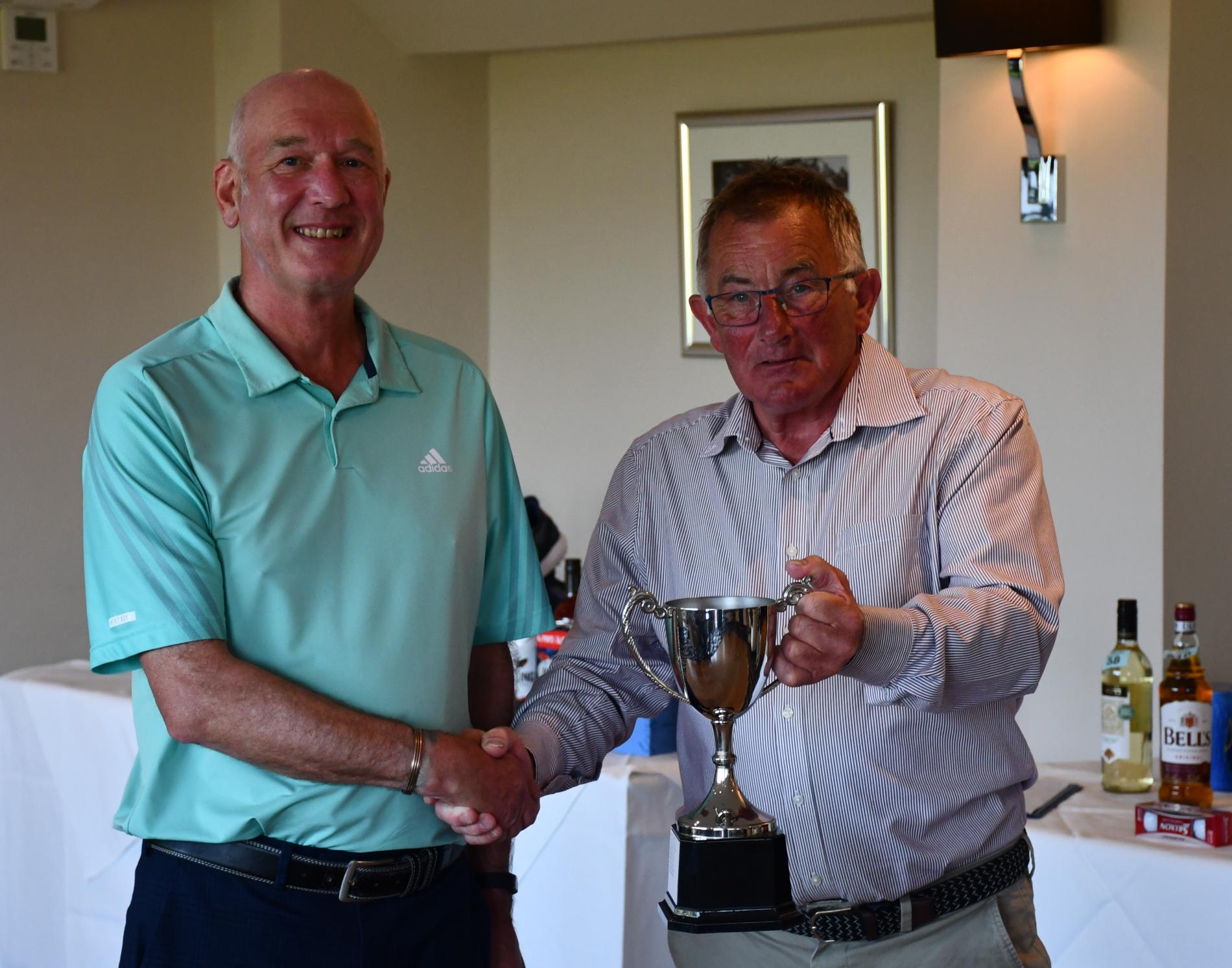 Senior Captains Day winner Tony Humphreys receiving the trophy from Captain Clive Frost